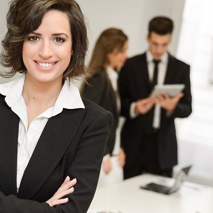 Business leader looking at camera in working environment
