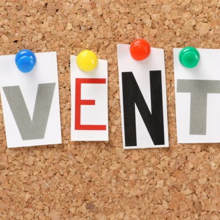 The word Events on a cork notice board The word Events on a cork notice board