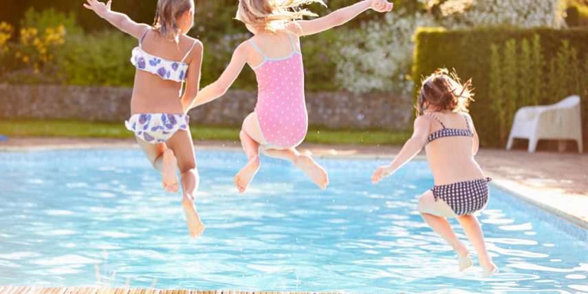 Group Of Girls Jumping Into Outdoor Swimming Pool home owners insurance