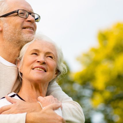 senior couple hugging in park Life insurance